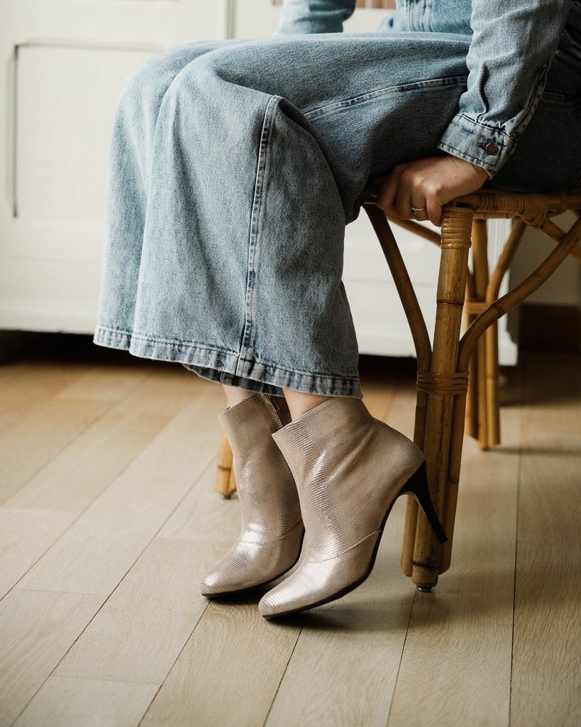 Heeled boot in bronze viperine and smooth black leather-2