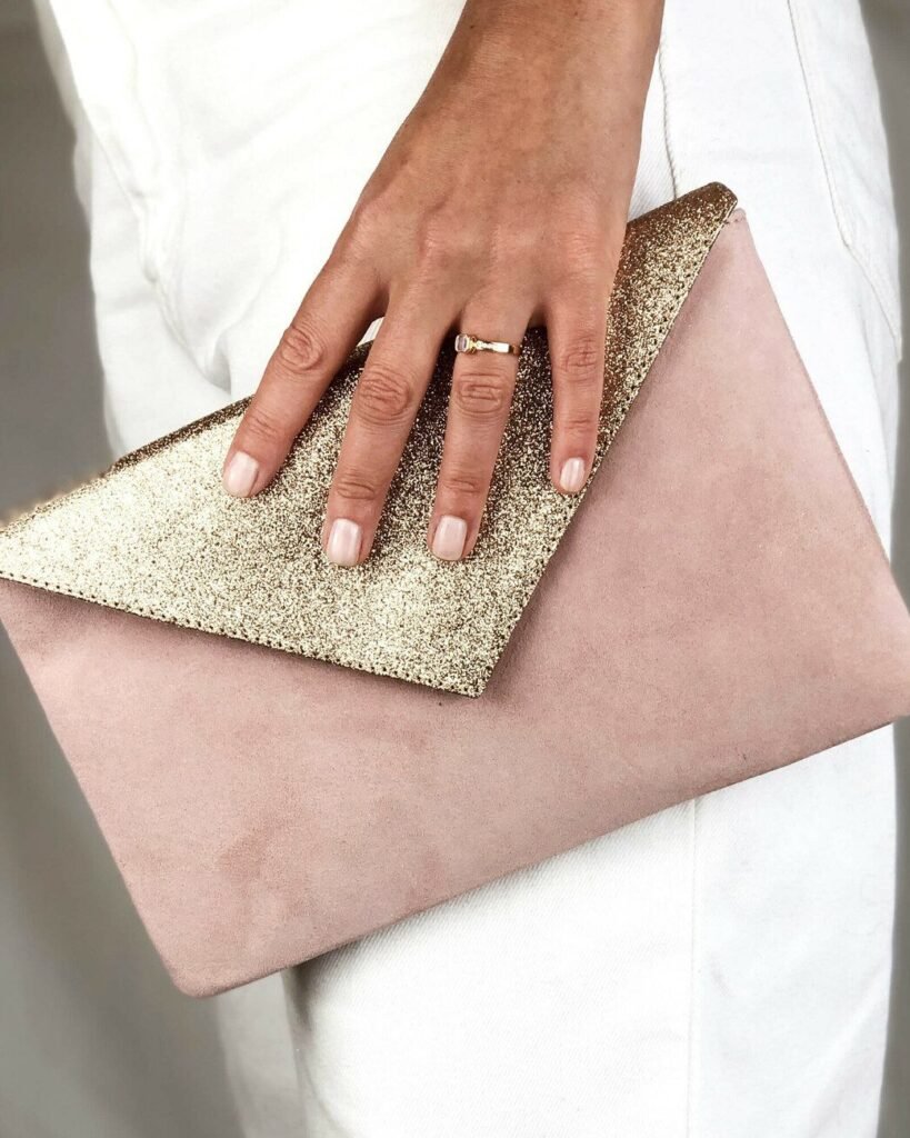 Ceremonial clutch bag in powder pink leather