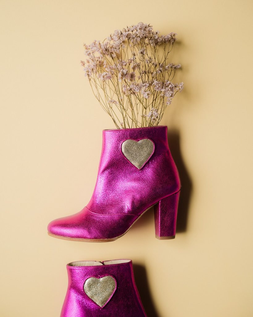 Fuchsia iridescent leather heart bootie.
