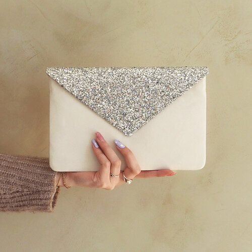 White smooth leather and silver glitter clutch bag
